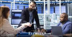 elitelia insights what is structured asset finance imagen editorial Factory manager and investors reviewing structured asset finance documents